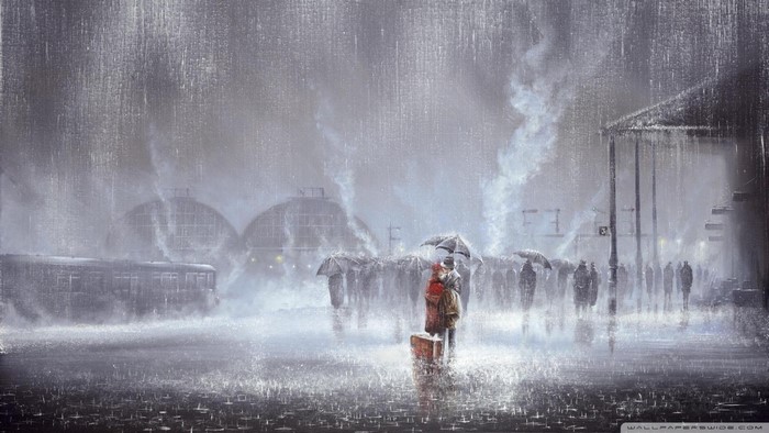 Couple kissing at a rainy train station