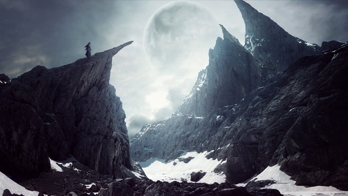 Fantasy art of a person on a rocky peak with a large moon