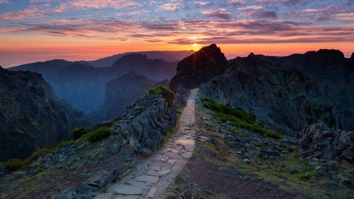 Mountain ridge path at sunset