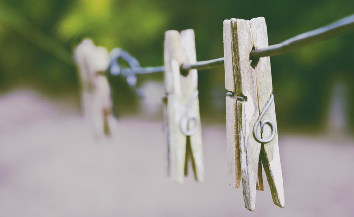 Wooden clothespins on a clothesline