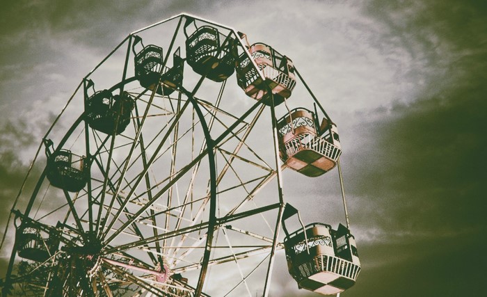 Ferris wheel against a cloudy sky