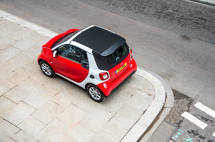 Red and white Smart Fortwo Passion Cabriolet car