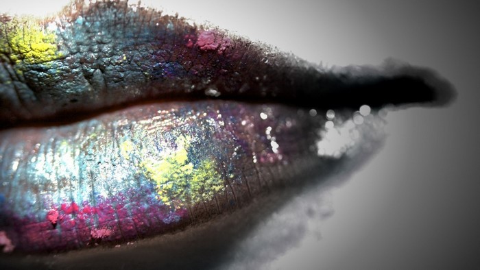 Close-up of lips with colorful glitter makeup
