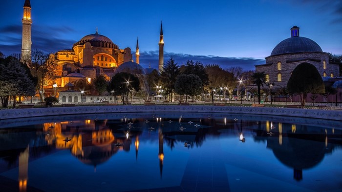 Hagia Sophia at dusk with reflection in water