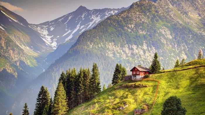 Scenic Alpine Landscape with Cottage in Swiss Alps