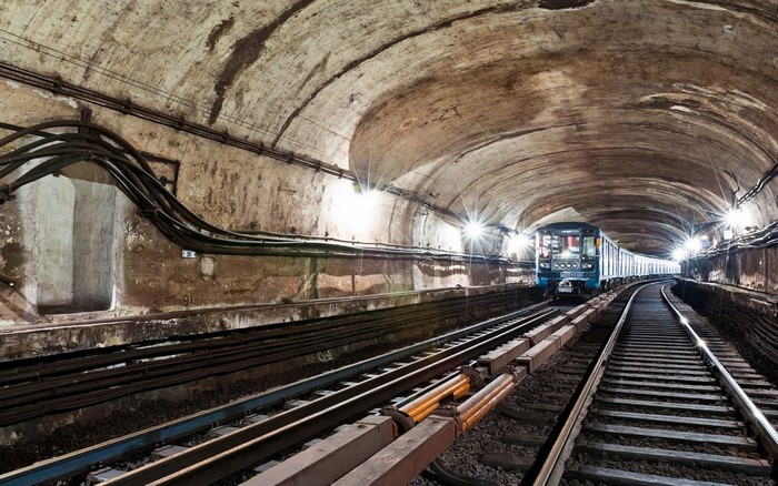 Train in a subway tunnel with multiple tracks