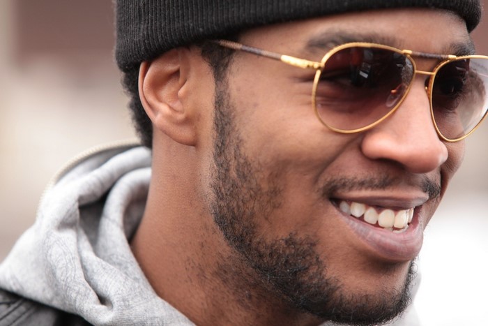 Kid Cudi wearing sunglasses and a beanie