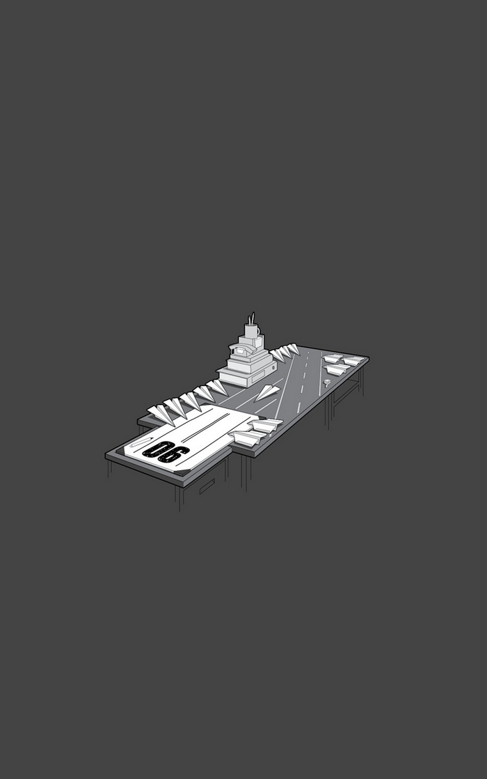 Paper airplane aircraft carrier on a desk
