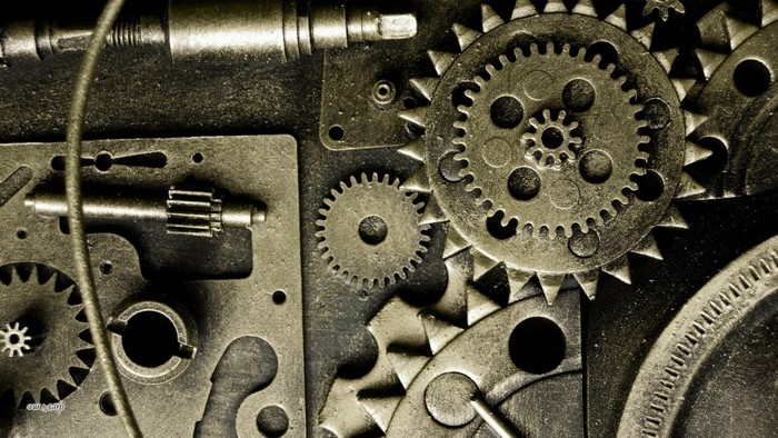 Close-up of interlocking metal gears and mechanical parts