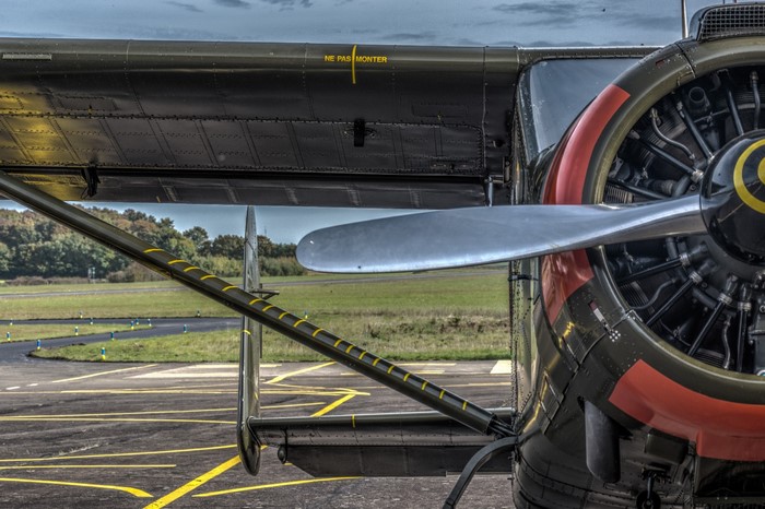 Close-up of an old airplane engine and wing