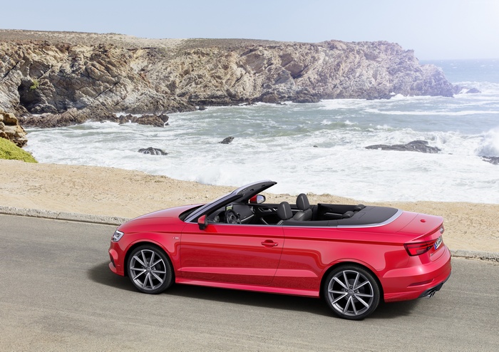 Red Audi A3 Cabriolet by the ocean