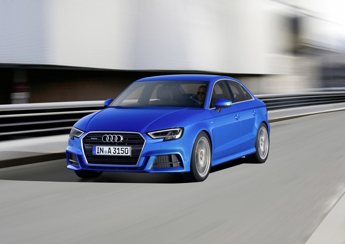 Blue Audi A3 Sedan driving on a road