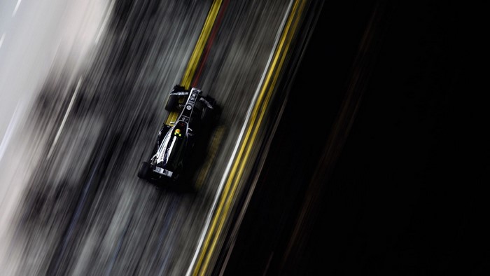 Formula 1 race car on track with motion blur
