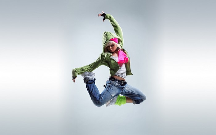 Woman in mid-air jump, breakdancing
