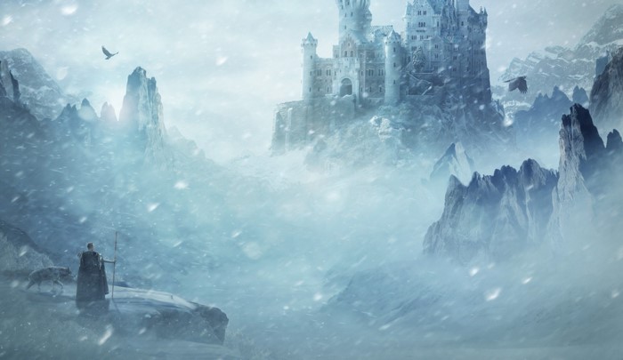 Fantasy castle in a snowy mountain landscape with a man and wolf