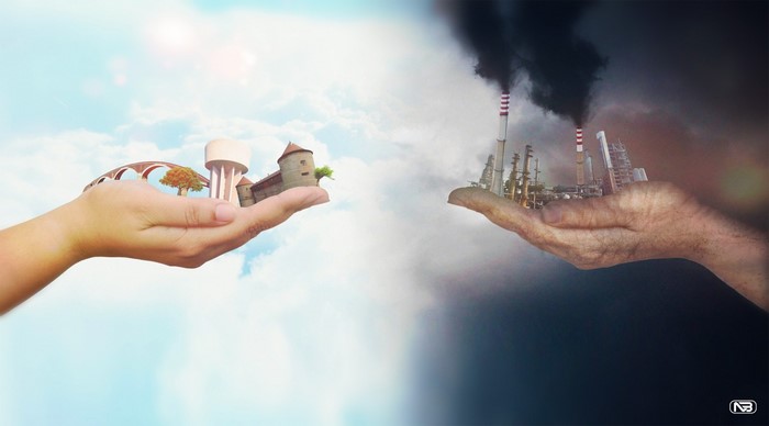 Hands holding contrasting environments: nature vs. industry