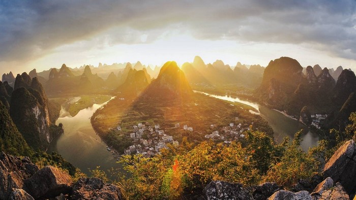 Karst mountains and river at sunrise in China