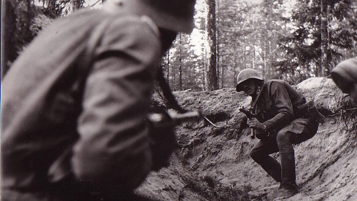 Soldiers in a trench during combat