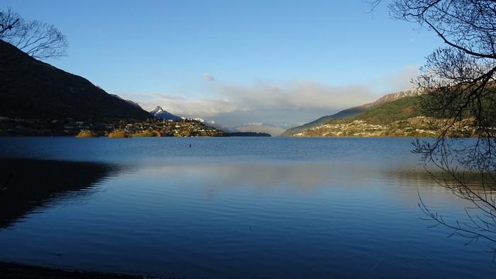 Lake Wakatipu with mountains and town in Queenstown, New Zealand