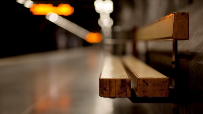 Bench in a subway station with bokeh lights