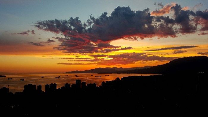 Sunset over Vancouver with city skyline and mountains