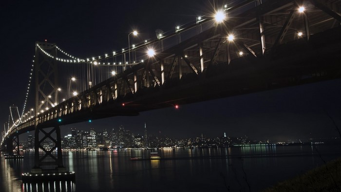 Bay Bridge at night with San Francisco skyline