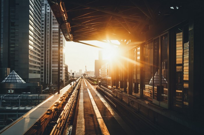 Cityscape with train tracks at sunset in Japan