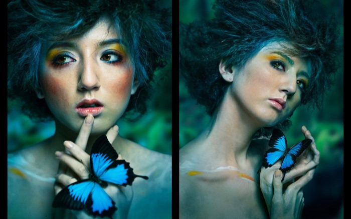 Woman with blue butterfly and fantasy makeup