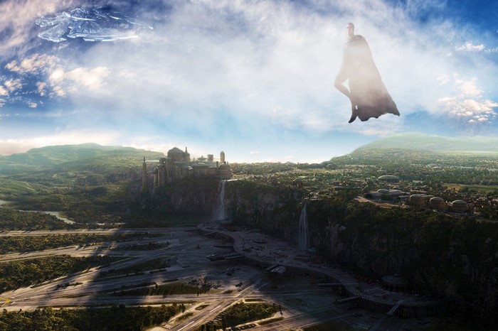 Superman flying over a futuristic city with waterfalls