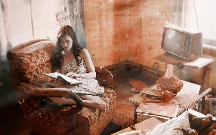 Woman reading in a cluttered room with a vintage TV