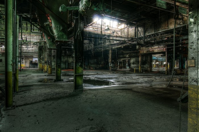 Abandoned factory interior with industrial machinery
