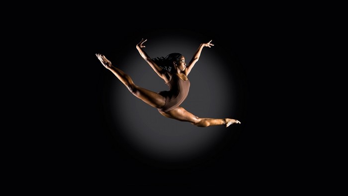 Graceful Female Dancer Mid-Split Leap