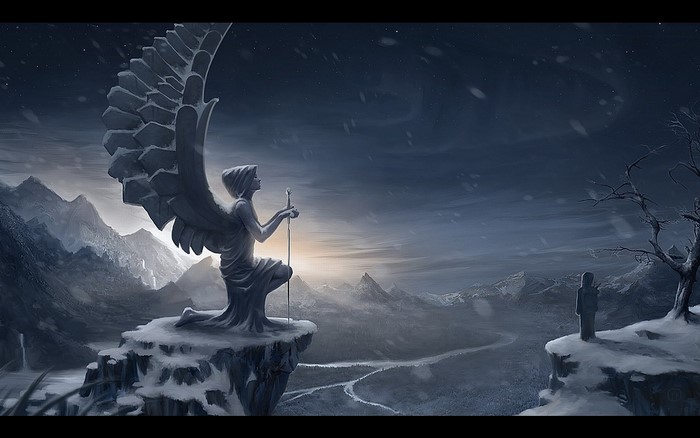 Angel statue on a snowy cliff overlooking a valley