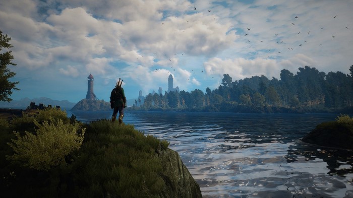 Geralt of Rivia overlooking a lake in The Witcher 3