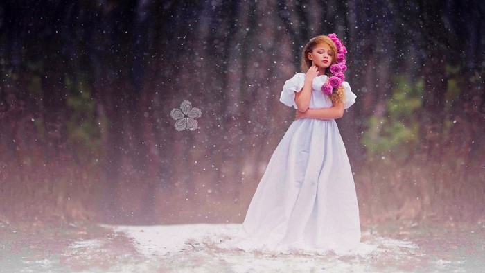 Girl in white dress with pink roses in hair
