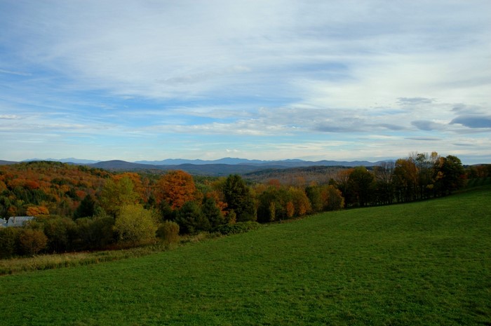Autumn landscape with rolling hills and mountains
