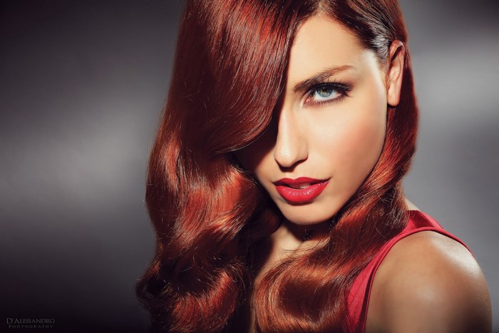 Woman with red hair and red lipstick