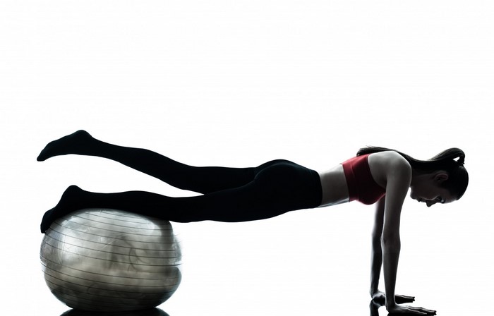 Woman exercising with a Swiss ball