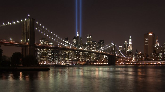 Tribute in Light over Brooklyn Bridge and Manhattan Skyline at Night