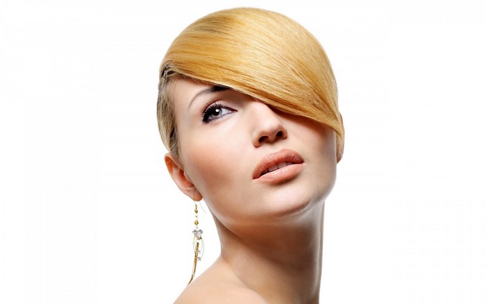 Blonde woman with bangs and earring