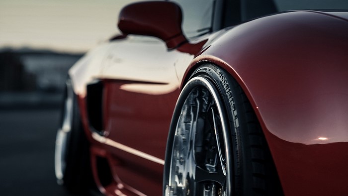 Red Honda NSX sports car wheel and fender