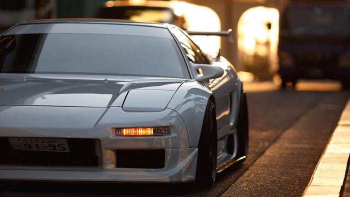 White Honda NSX sports car with spoiler