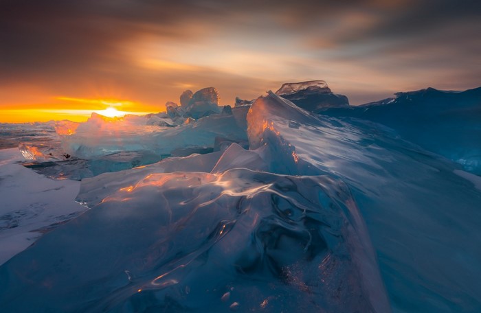 Sunset over ice formations on a frozen sea