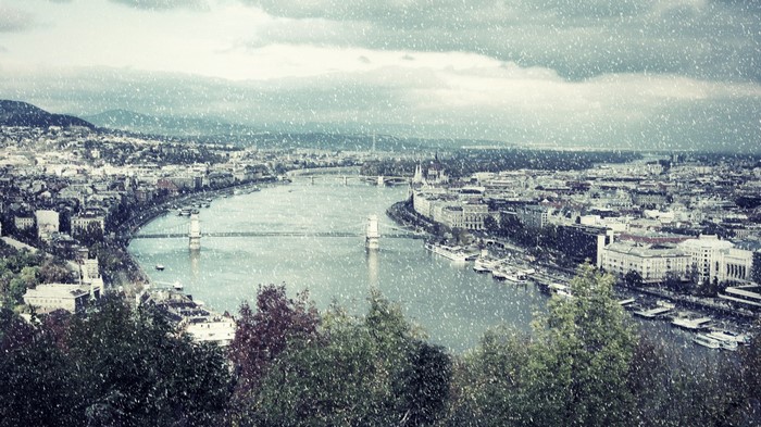 Budapest cityscape with Danube River and bridges in snow