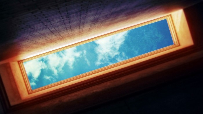 Rectangular skylight showing blue sky with clouds