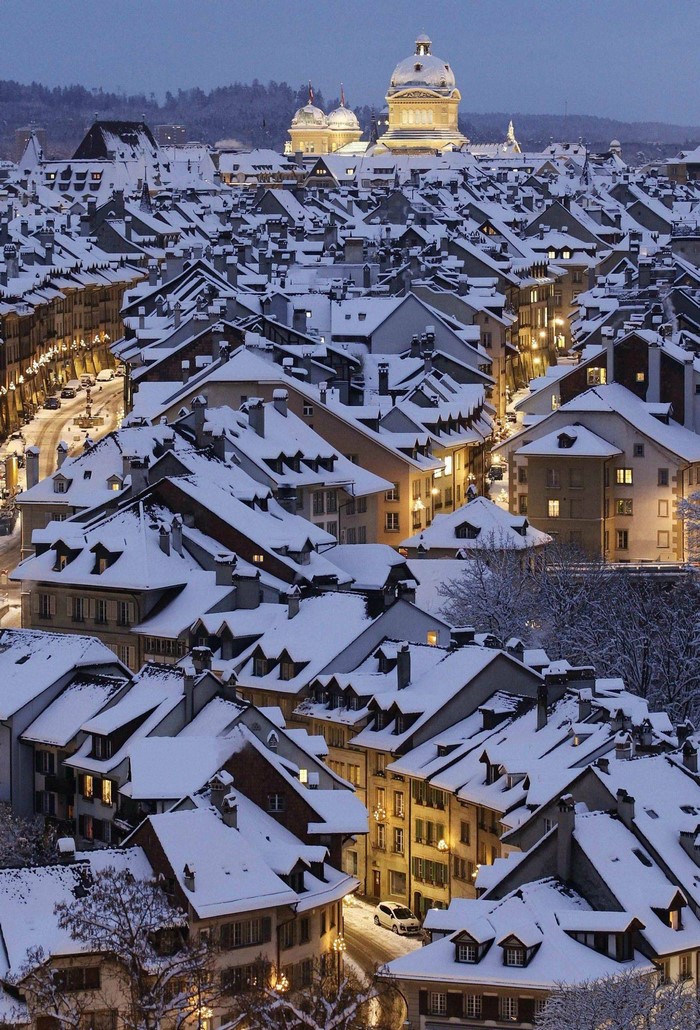 Bern cityscape covered in snow at dusk