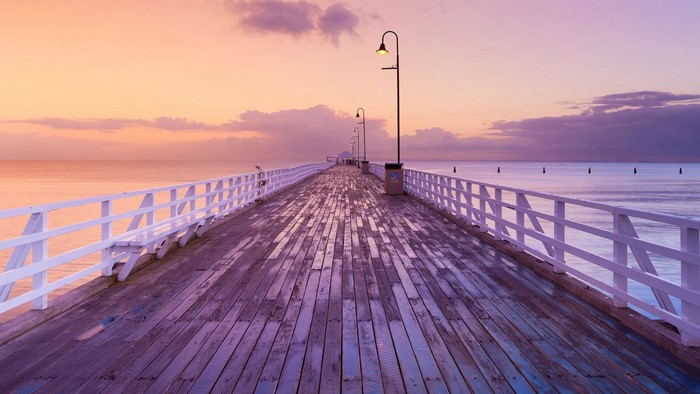 Pier at sunset over the ocean