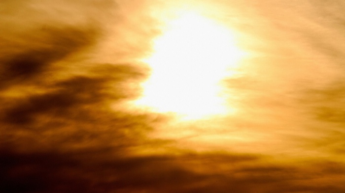 Sun shining through clouds
