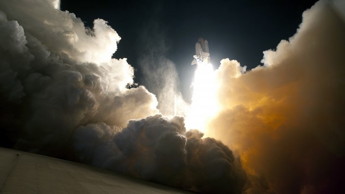 Space Shuttle Launch with Bright Smoke Plumes