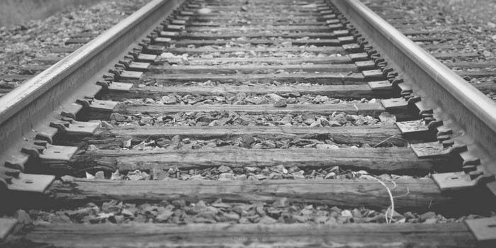 Close-up of a railway track with wooden sleepers